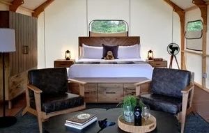 image Cozy glamping interior with plush seating and a warm ambiance, perfect for relaxation.