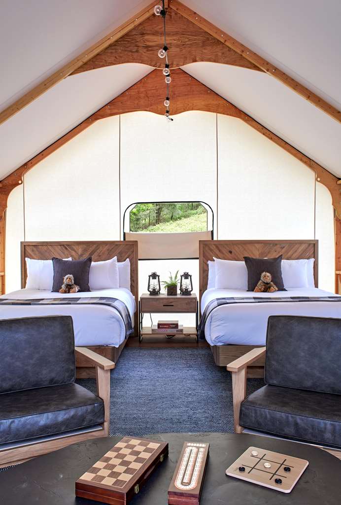 image Cozy glamping interior with plush seating and ample natural light, perfect for unwinding.