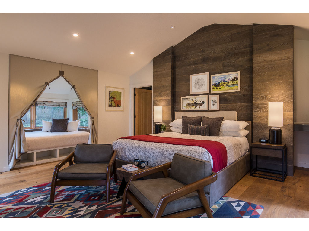 image Relax in a beautifully appointed bedroom with modern comforts and a cozy feel.