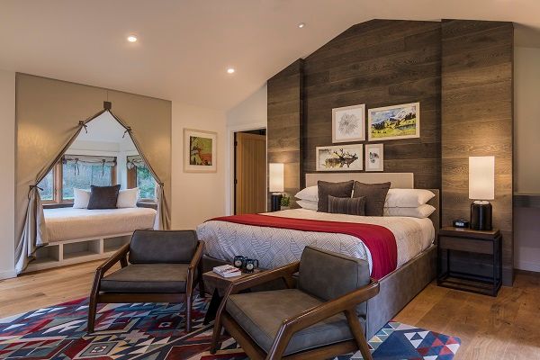 image Relax in a beautifully appointed bedroom with modern comforts and a cozy feel.