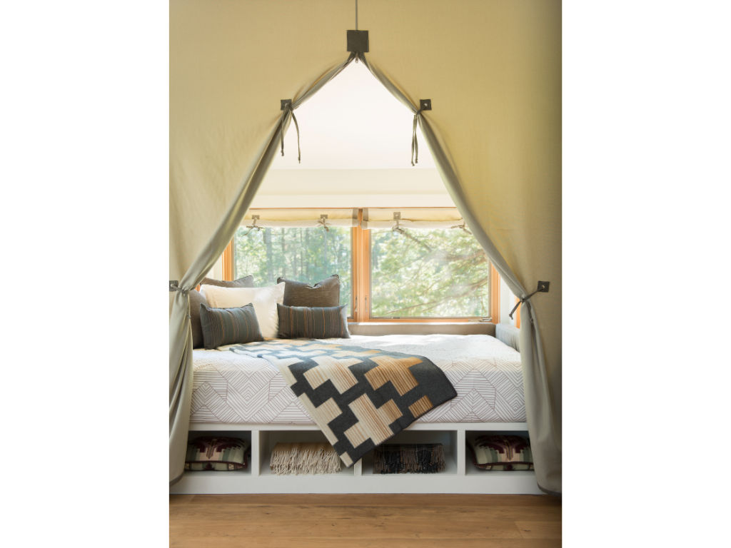 image Delight in a charming bedroom with rustic decor and a comfortable, inviting bed.