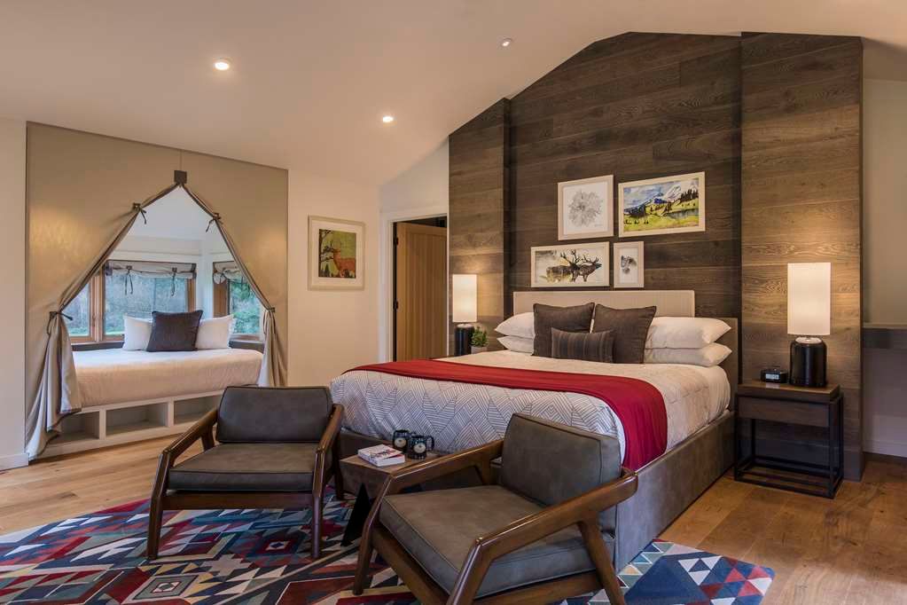 image Indulge in comfort with this spacious and stylishly decorated bedroom, featuring modern touches and cozy accents.