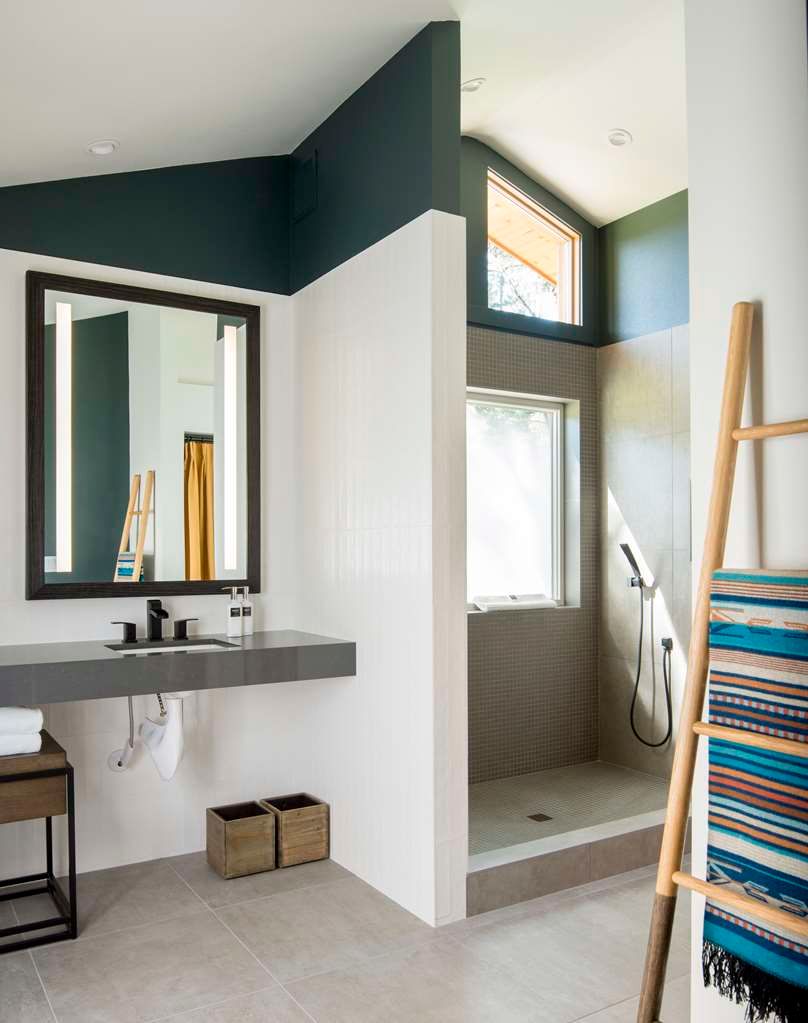 image Modern bathroom with elegant fixtures and ample natural light, perfect for a refreshing start to your day.