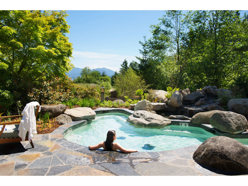 image Unwind at the Skamania Lodge outdoor spa, surrounded by nature's beauty.