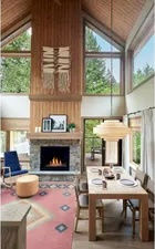 image Spacious living area with high ceilings and a cozy fireplace, ideal for relaxing evenings.