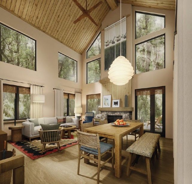 image Spacious living area with high ceilings and a cozy fireplace, ideal for relaxing evenings.