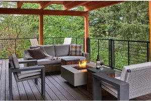 image Relax on the expansive deck with stylish outdoor furniture and stunning forest views.