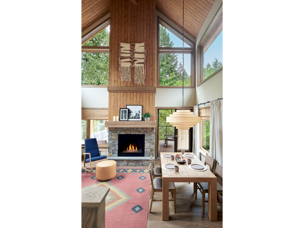 image Spacious living area with high ceilings and a cozy fireplace, ideal for relaxing evenings.