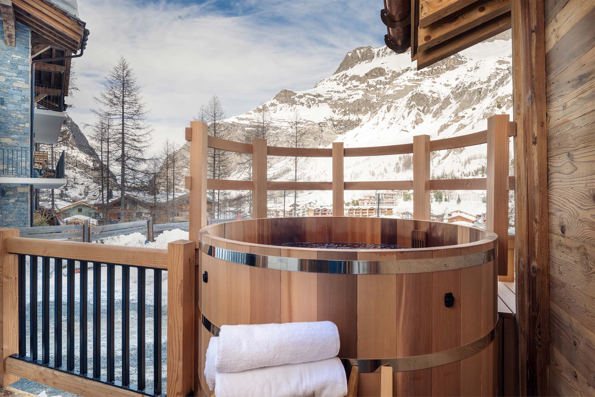 image Unwind in the private nordic bath on the balcony, offering serene mountain views and the perfect spot to relax under the stars after an adventurous day.