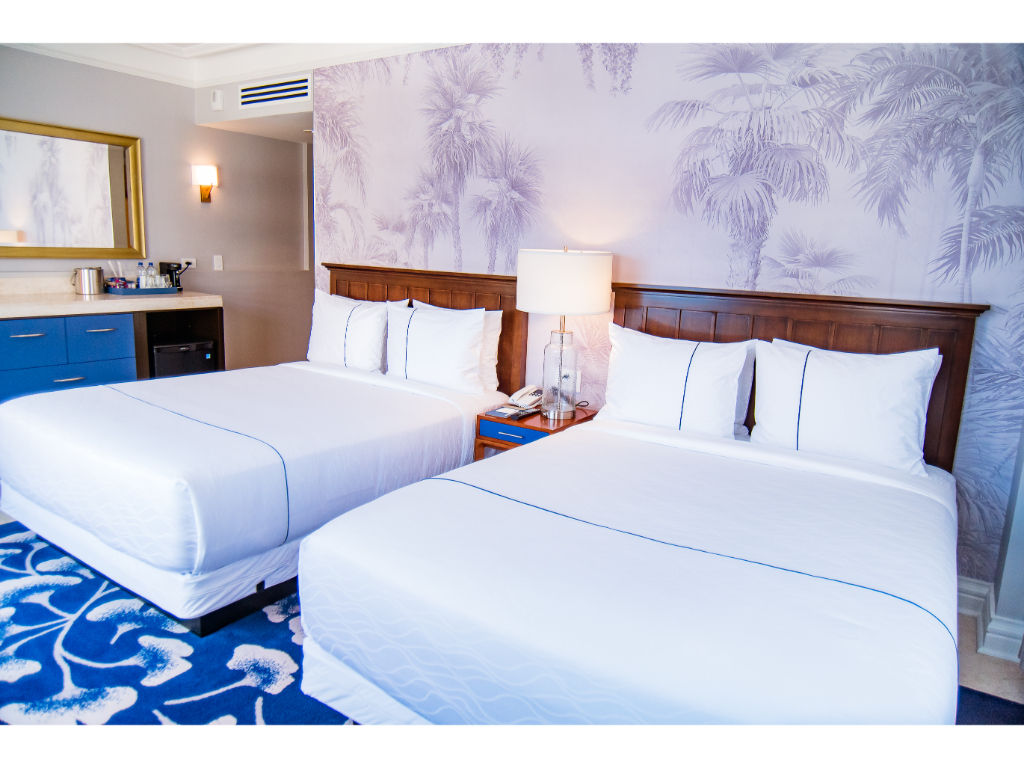 image Comfortable double beds in a beautifully decorated room.