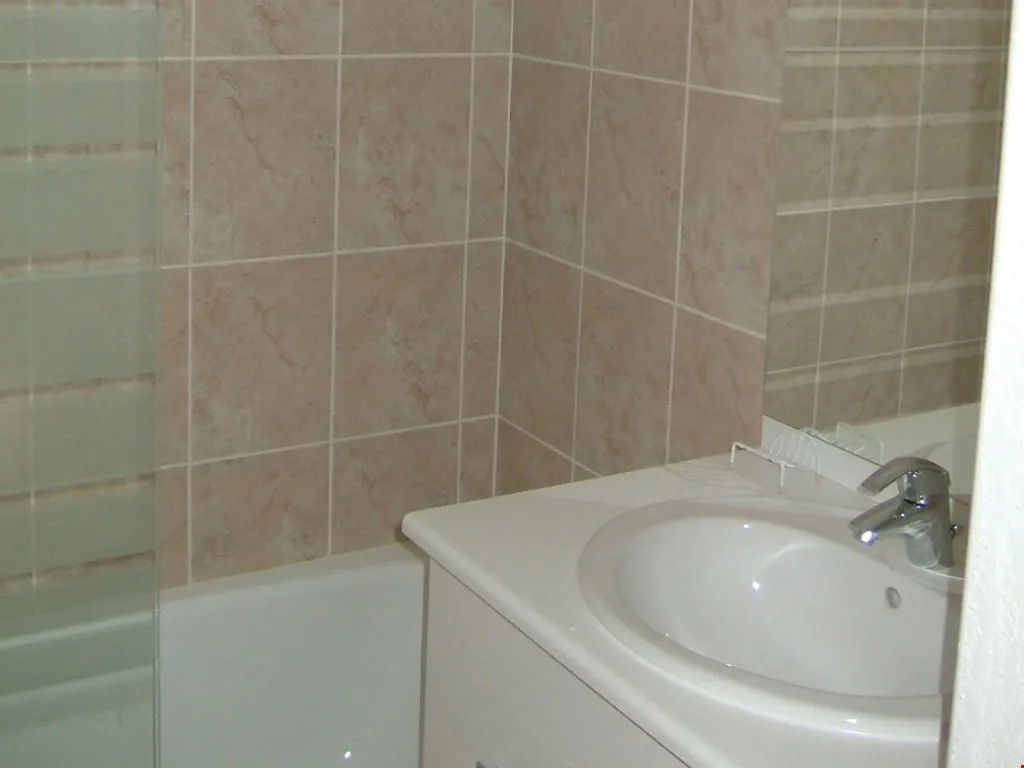 image Get ready for the day in the cozy bathroom.
