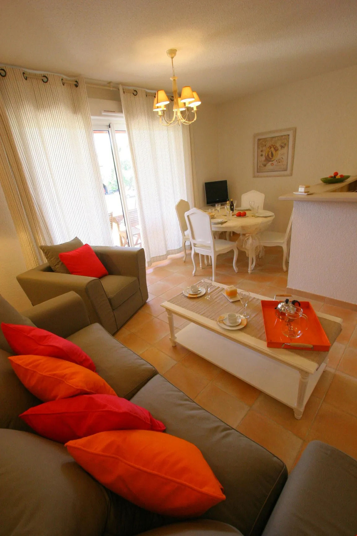 image Relax and unwind in the cozy, well-appointed living room.