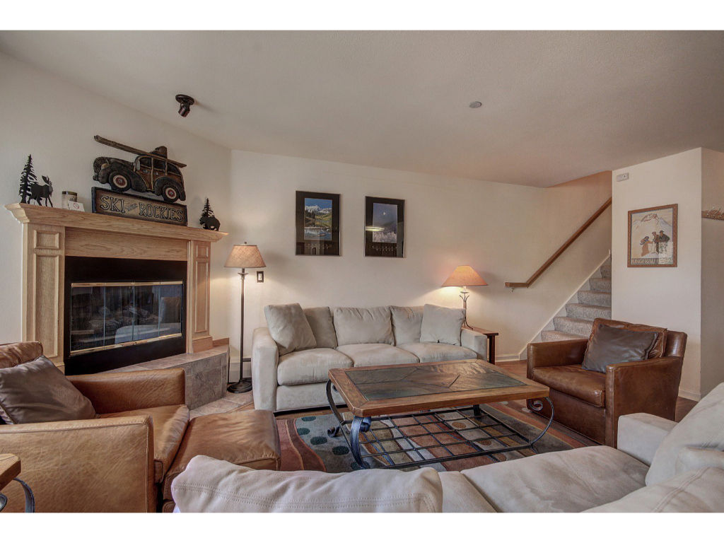 image Cozy living area featuring a warm fireplace and ample seating, perfect for relaxing evenings.