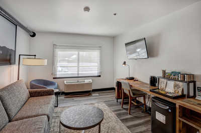 Bright and inviting living space with a comfortable lounge area, perfect for relaxing after a day of adventure.