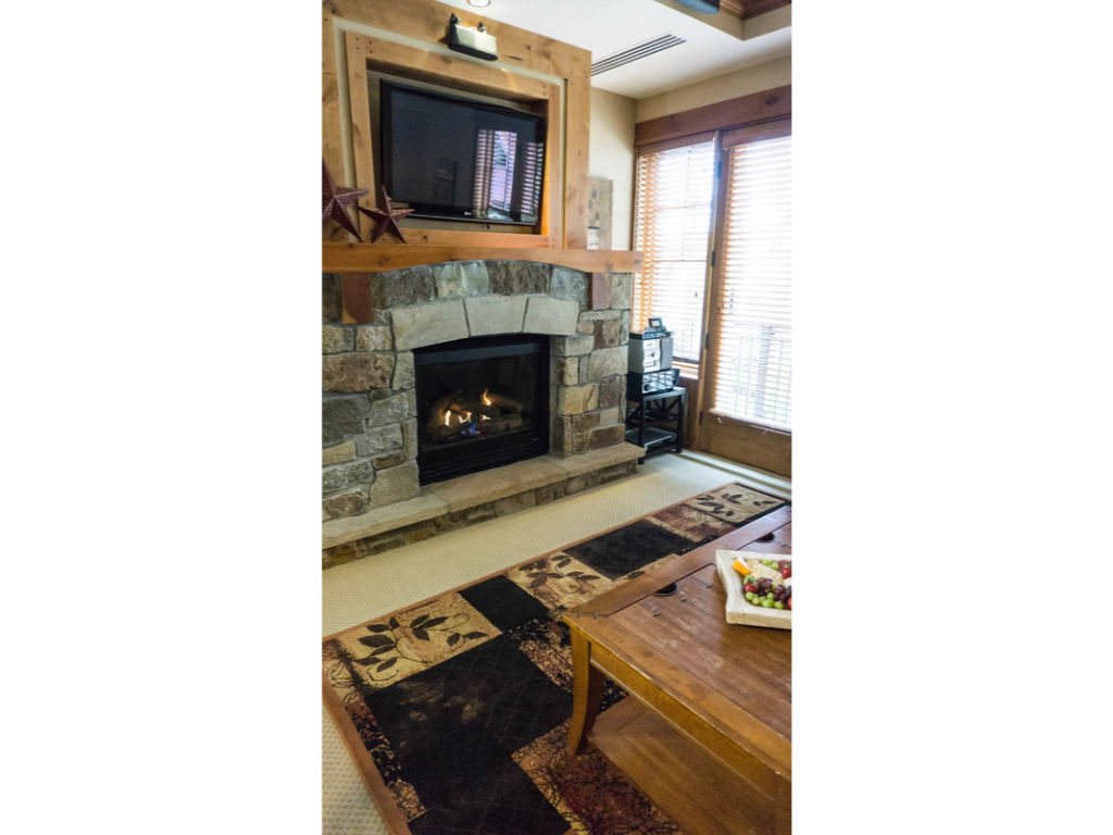 image This cozy living room features a charming fireplace, perfect for relaxing after a day of adventure.