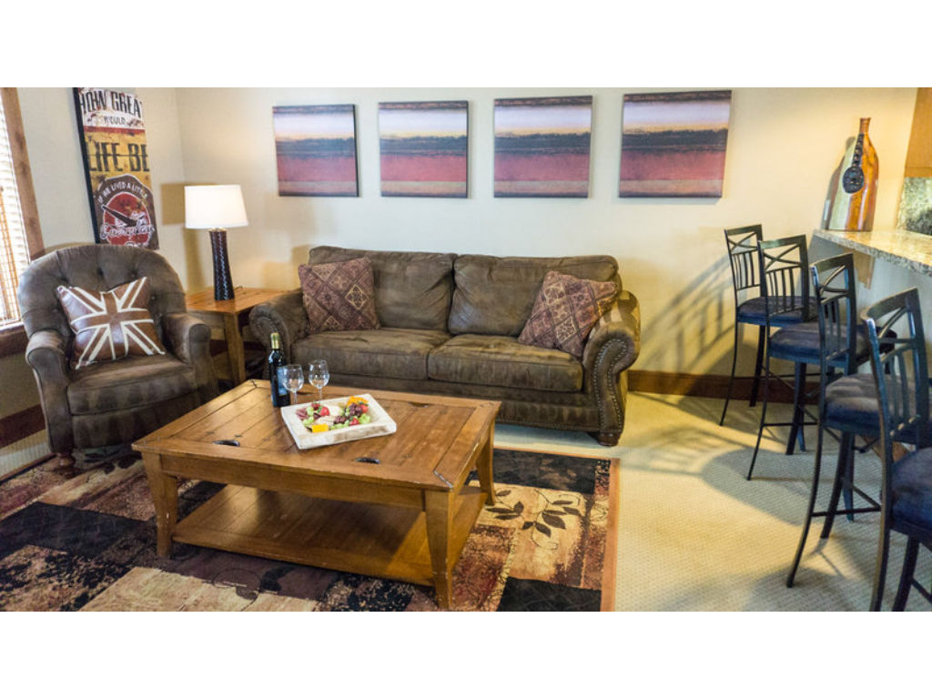 image The living area offers comfortable seating and a welcoming atmosphere for socializing and unwinding.