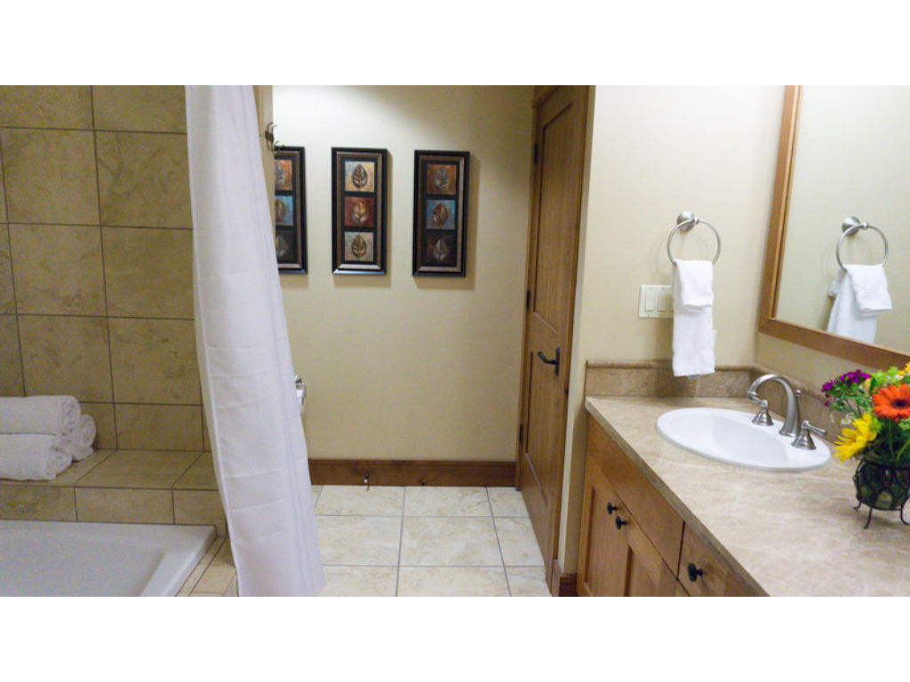 image The bathroom is well-equipped with modern fixtures and ample counter space for your needs.