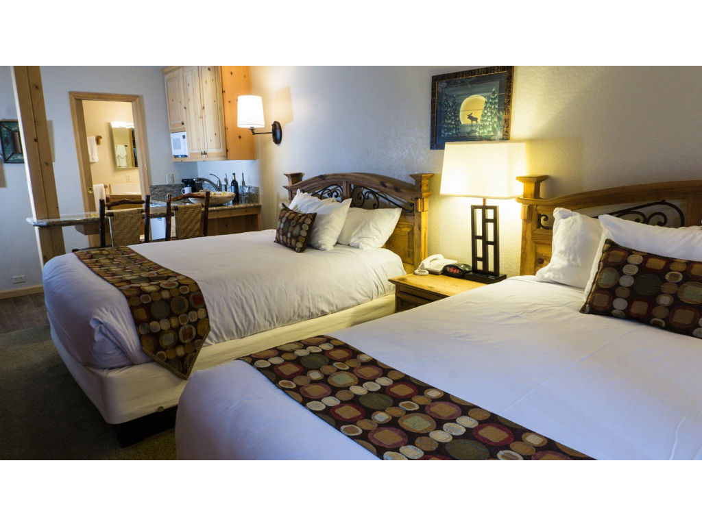 image Relax in style with these double beds, adorned with luxurious bedding and tasteful decor.
