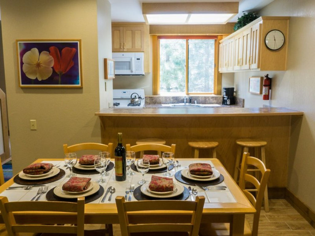 image Dining area set for a family meal, providing a cozy space to enjoy home-cooked dishes.