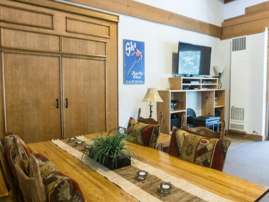 image Enjoy meals in this charming dining area, featuring wooden accents and a cozy atmosphere.