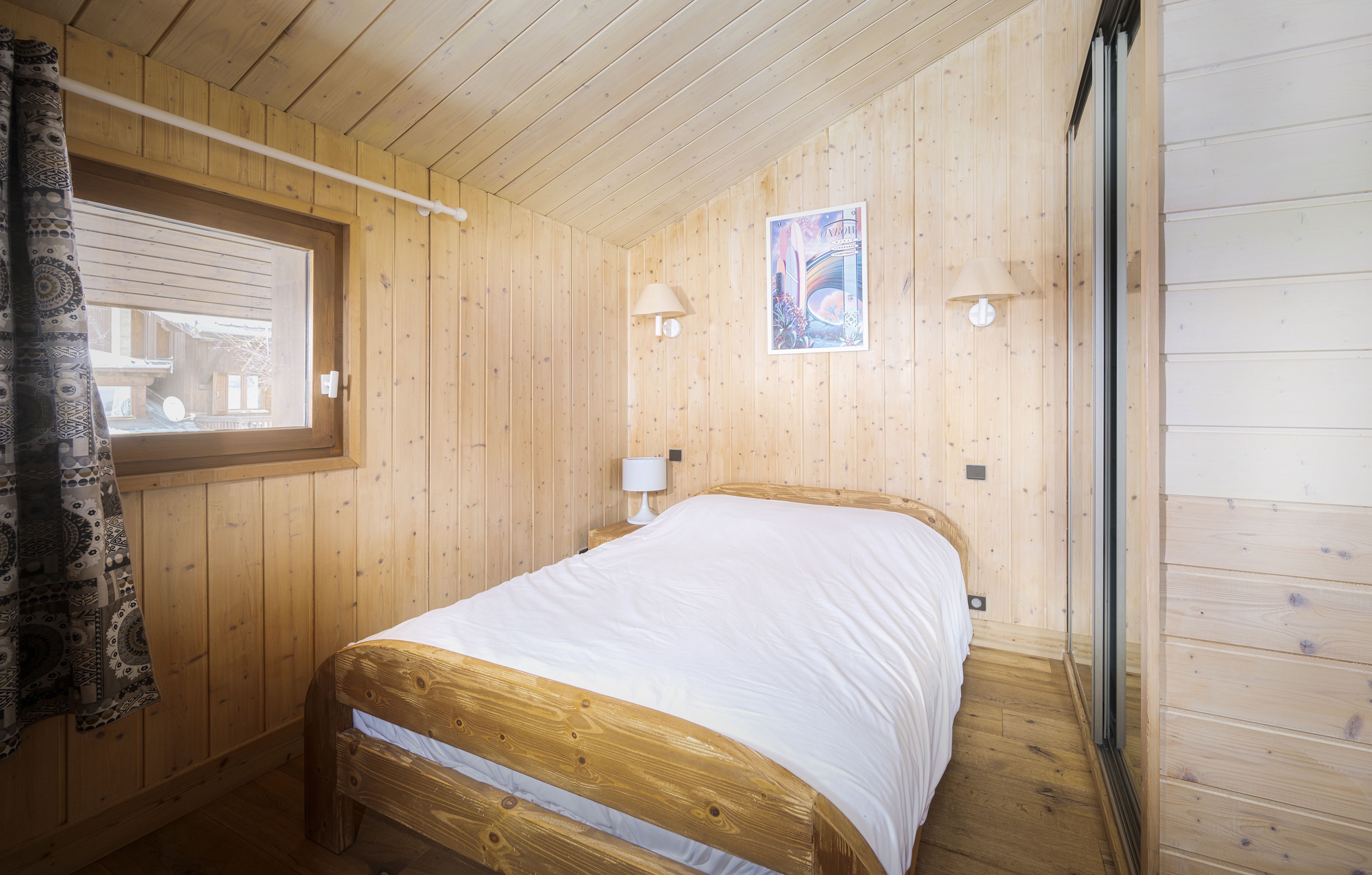 image Charming bedroom with a rustic wood finish, offering a peaceful retreat.