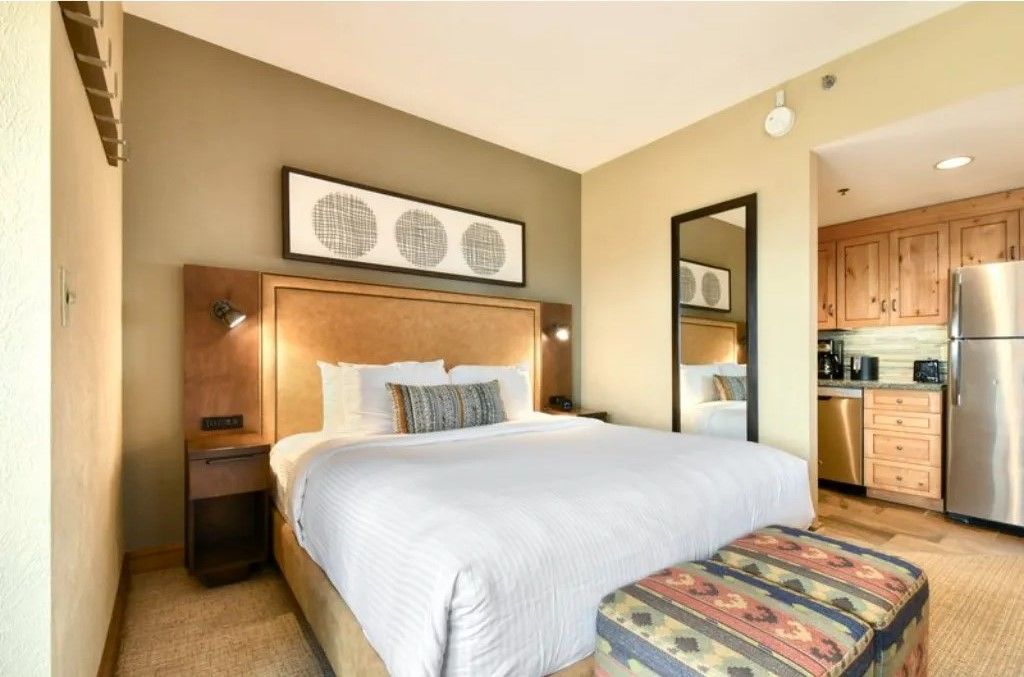 image Elegant bedroom with a king-size bed and stylish decor.