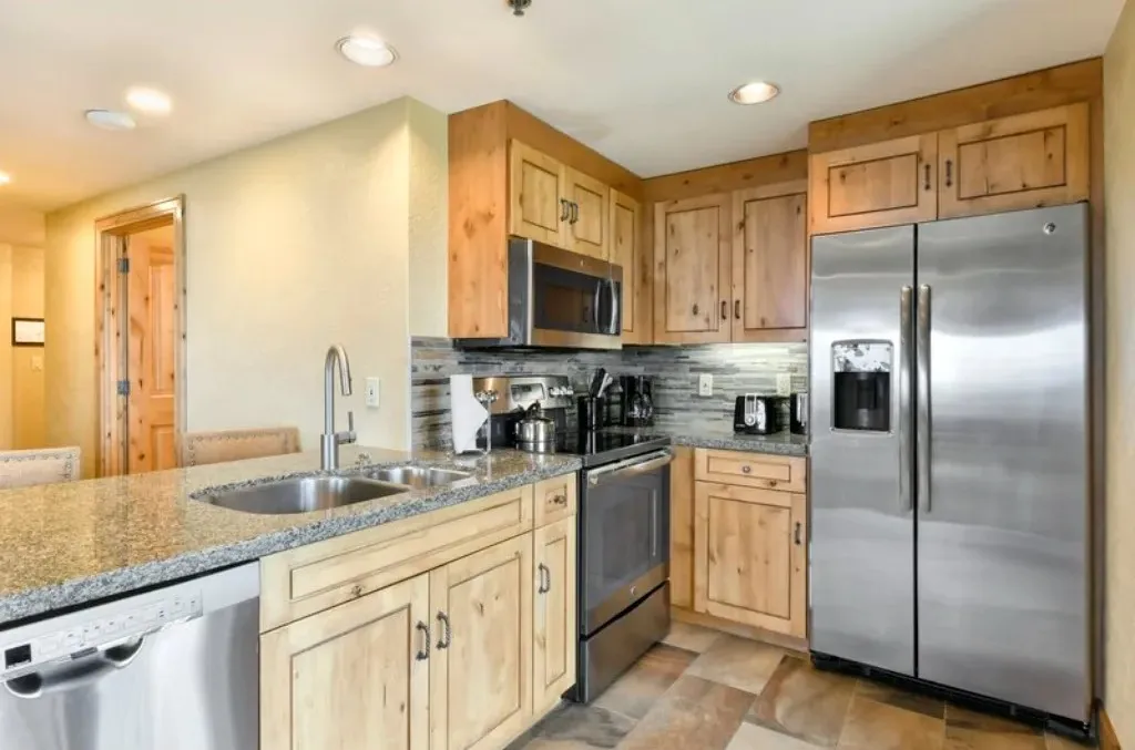 image Modern kitchen with stainless steel appliances and ample counter space.