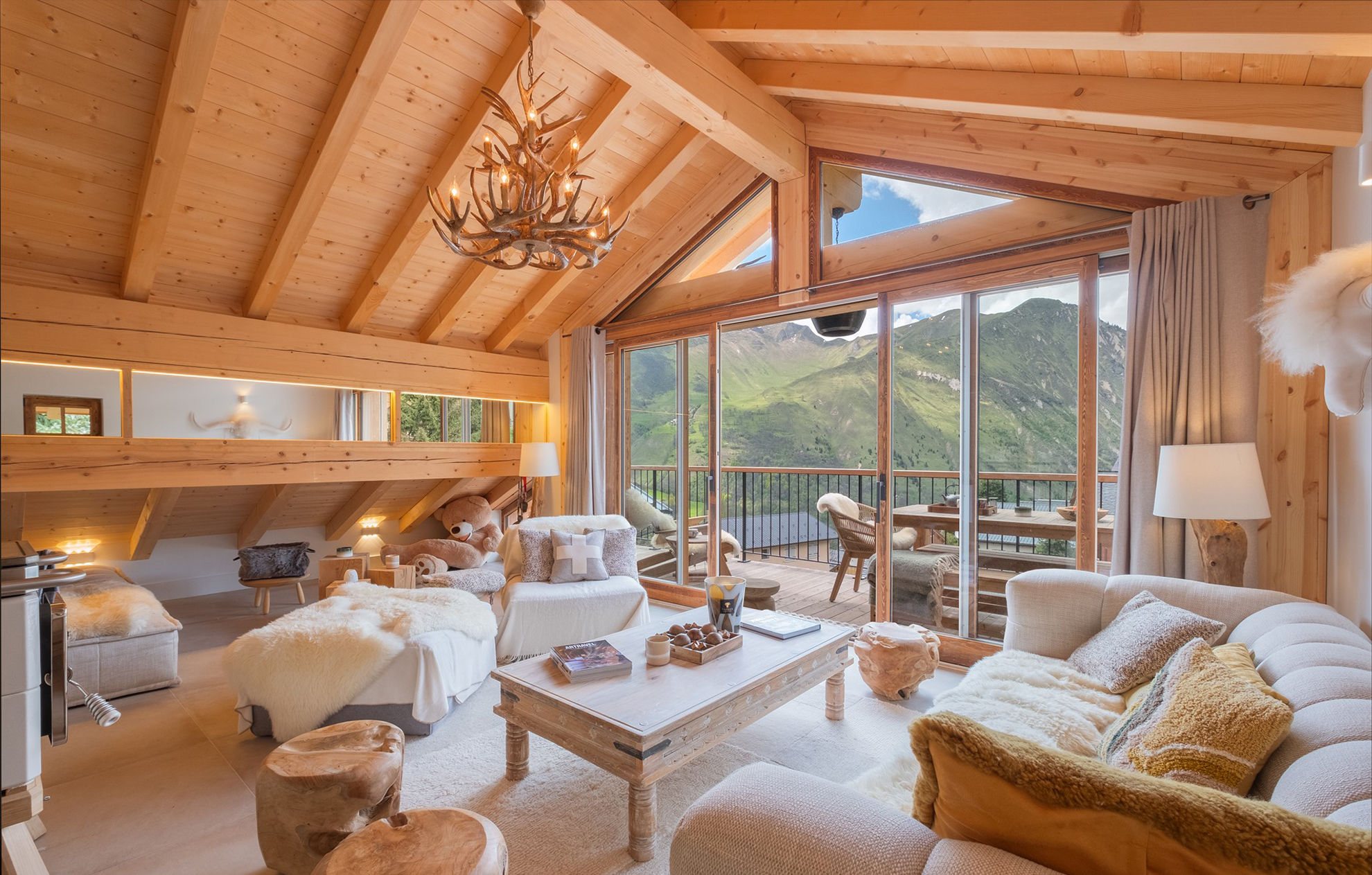 image Cosy up in this elegant living room with stunning mountain views and a balcony perfect for enjoying the serene landscape.