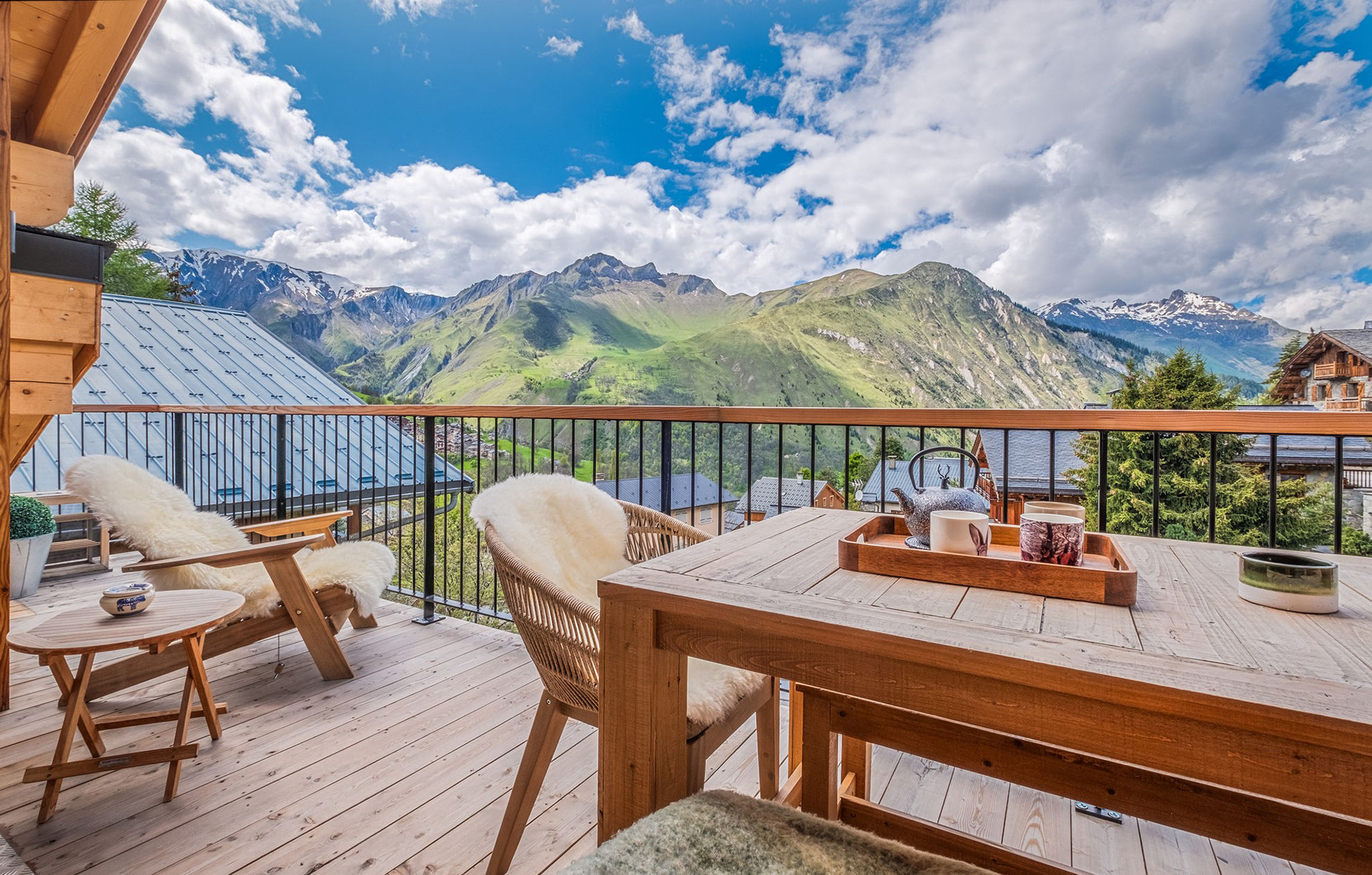 image Soak up the sun and fresh mountain air on this spacious balcony, offering unparalleled views of the rolling hills.