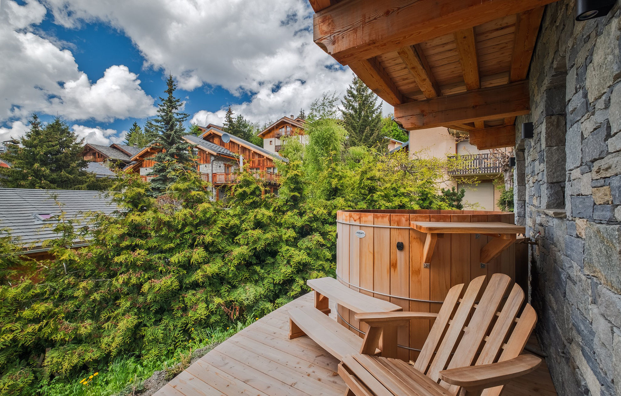 image Unwind in the private outdoor hot tub, surrounded by nature and serene mountain views.