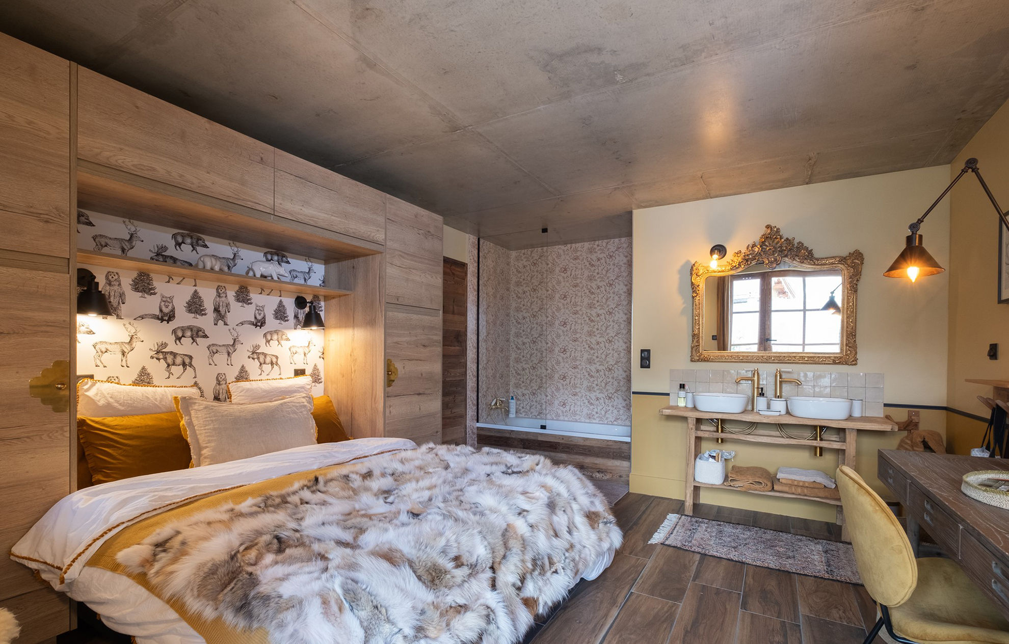 image This inviting bedroom features an en suite bathroom and warm decor that makes you feel right at home.
