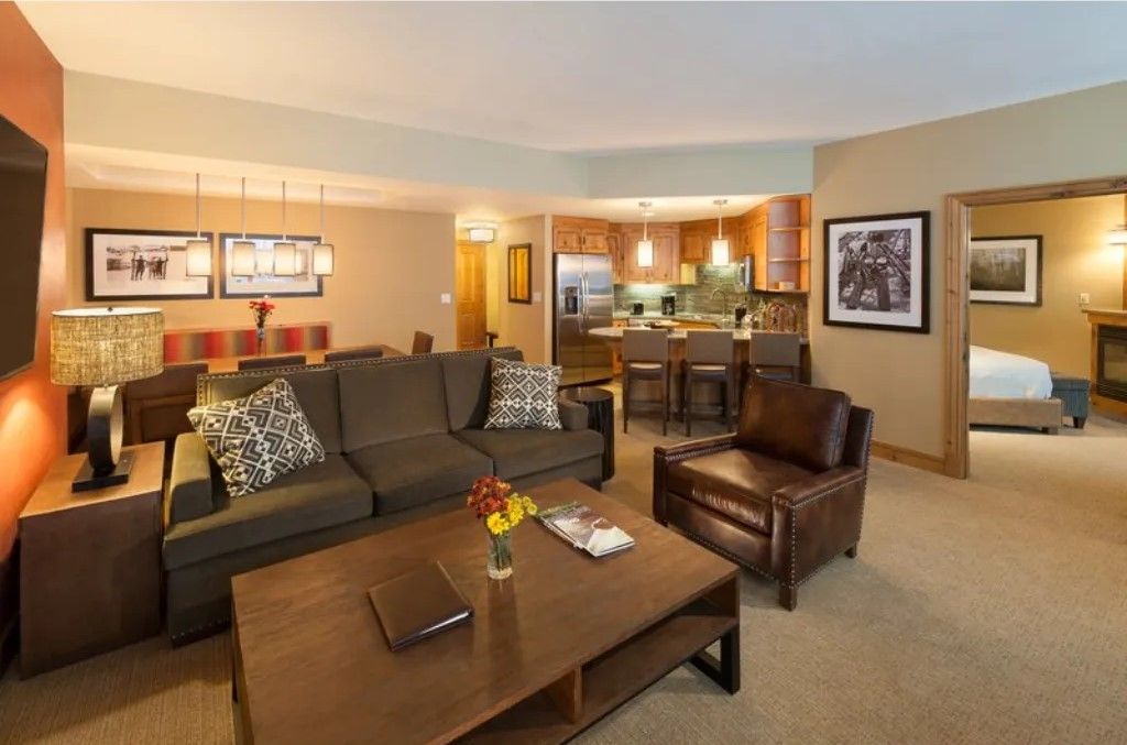 image Warm living room with ample seating and soft lighting.