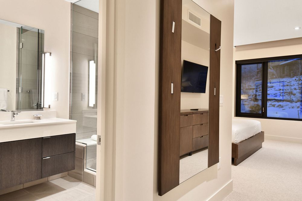 image Spacious bathroom with dual vanities and elegant lighting.