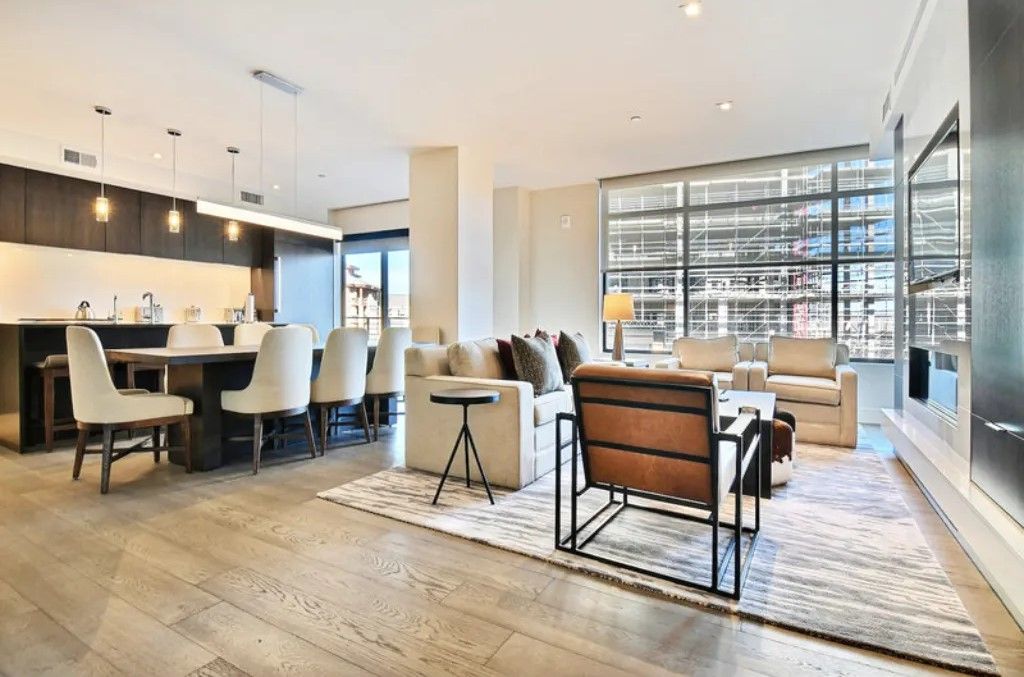 image Elegant dining area with floor-to-ceiling windows and natural light.