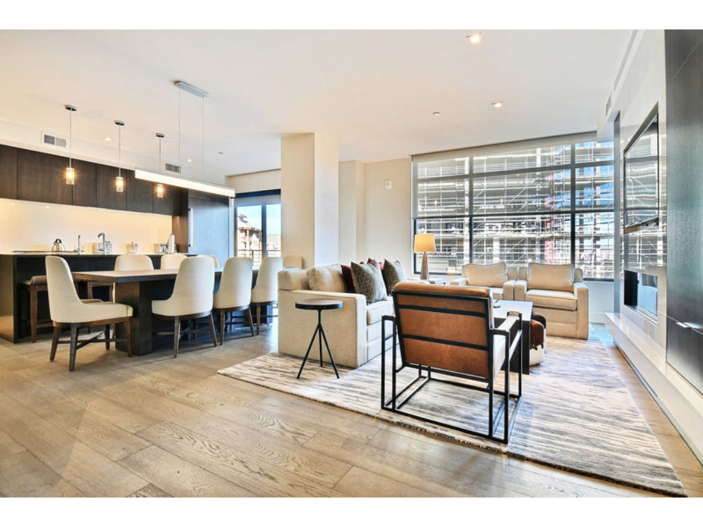 image Elegant dining area with floor-to-ceiling windows and natural light.
