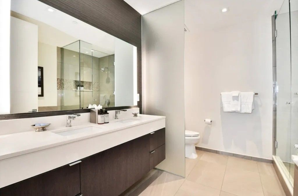 image Spacious bathroom with dual sinks and a contemporary design.