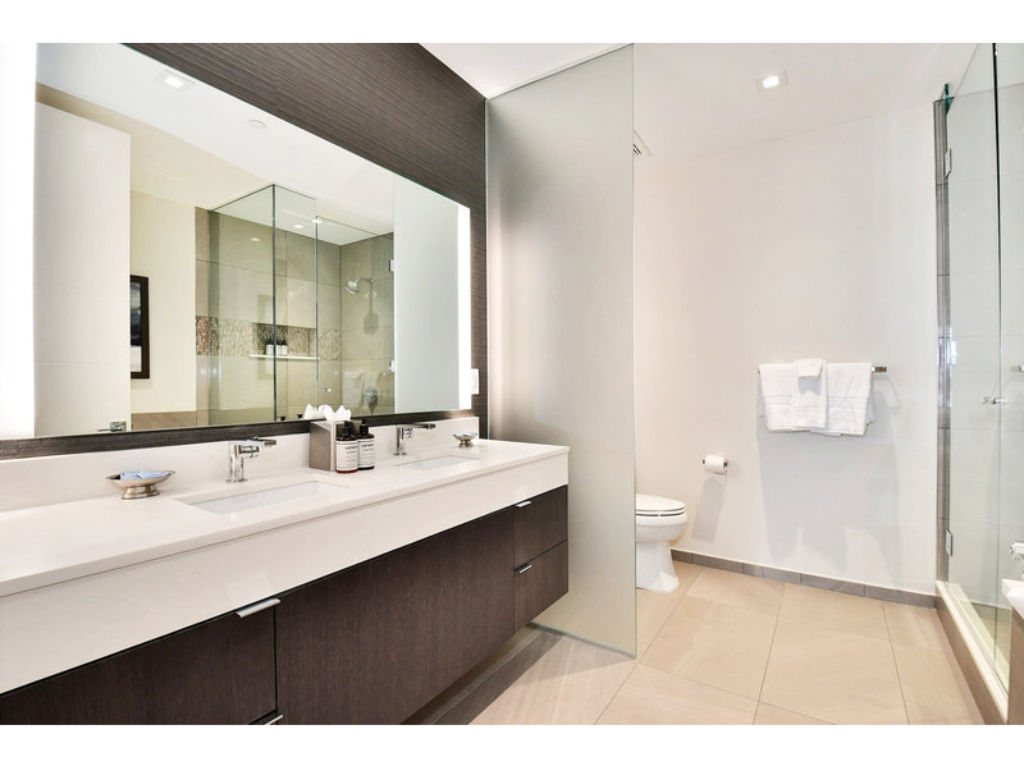 image Spacious bathroom with dual sinks and a contemporary design.