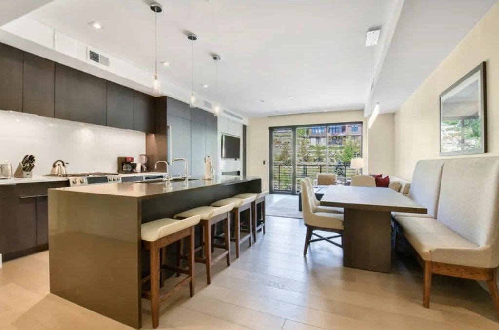image Modern kitchen with an island and open-plan design.