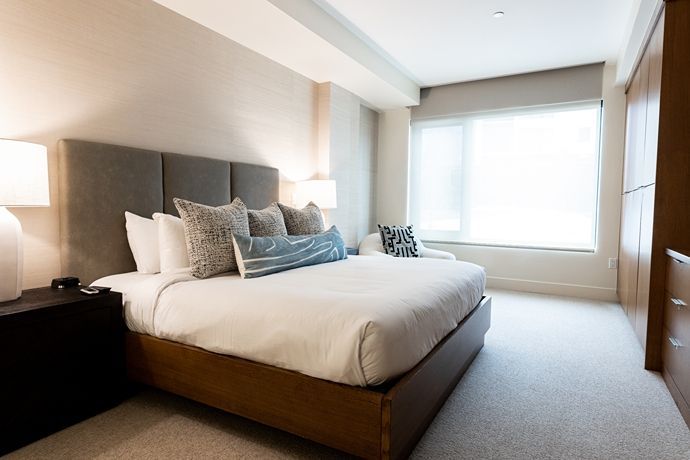 image  Cozy bedroom with soft bedding and elegant furnishings.