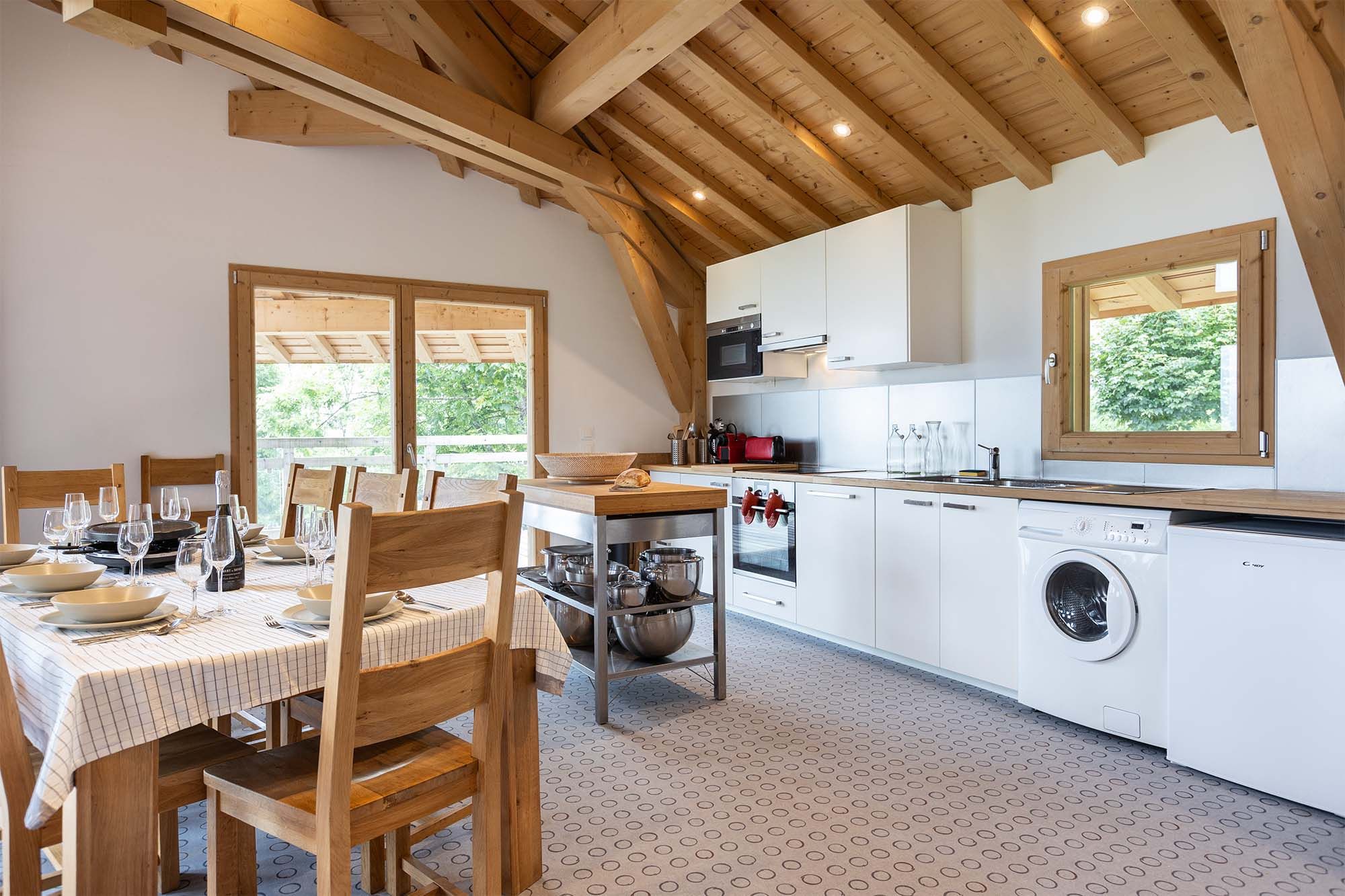 image This modern kitchen comes fully equipped with all the essentials, including a dishwasher, washing machine, and ample counter space. Whether you’re cooking a full meal or enjoying a quick snack, this space has everything you need.