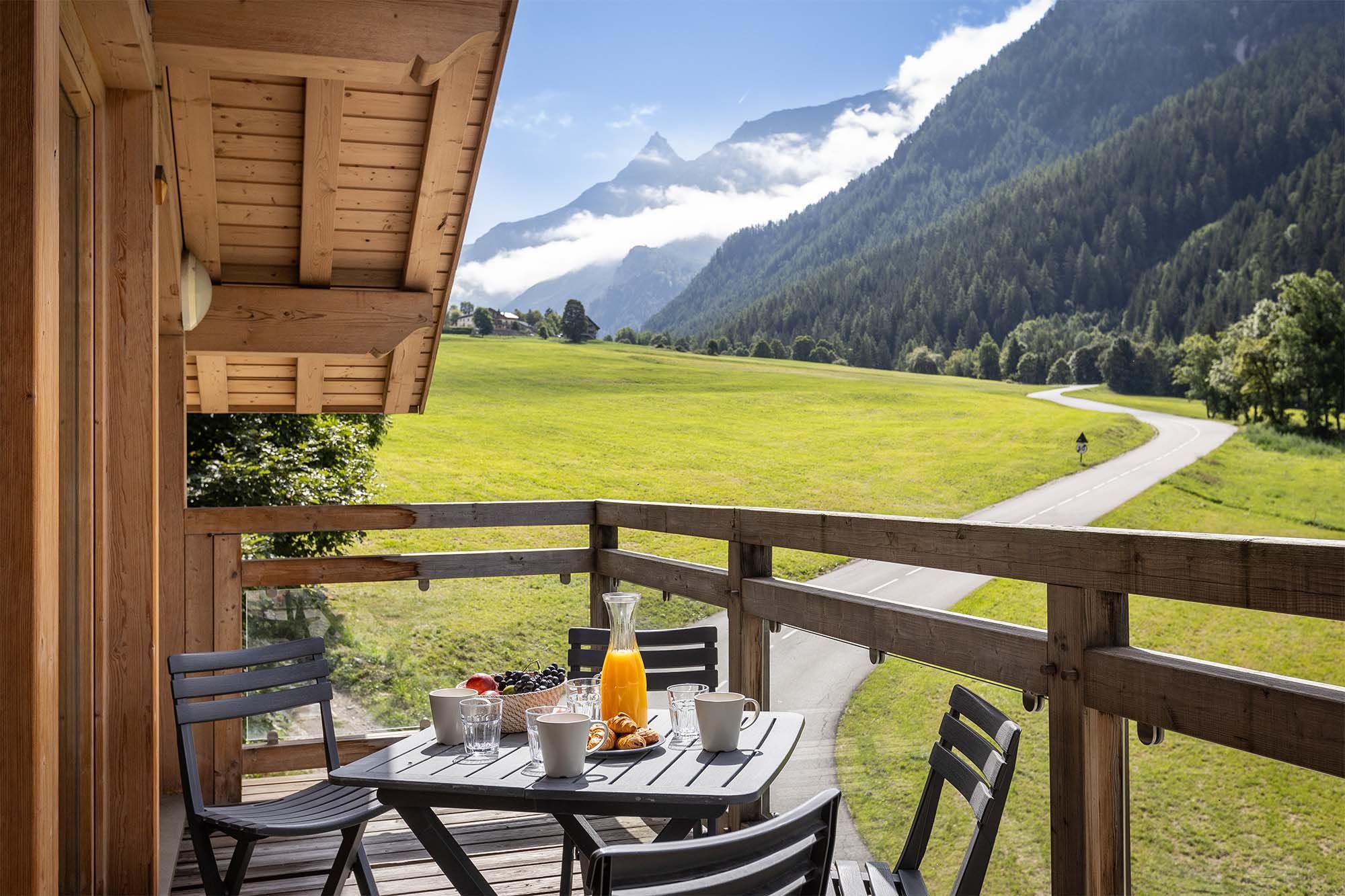 image Enjoy your meals alfresco on this balcony with breathtaking views of the valley and surrounding mountains. The perfect spot for morning coffee or sunset dinners while soaking in the fresh alpine air.