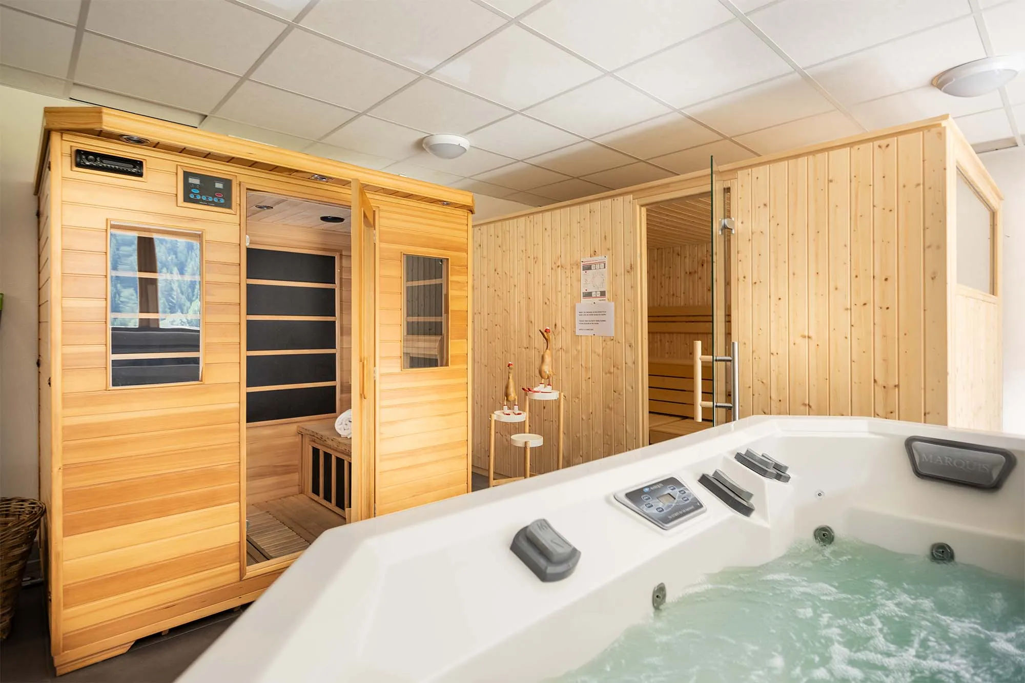 image Unwind in the shared wellness area with a hot tub and sauna. Includes one free spa session, with additional access available for a fee.