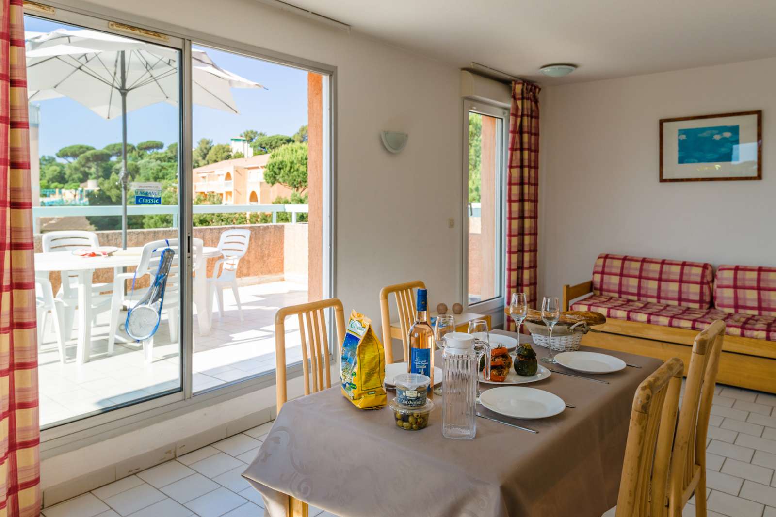 image Ground-floor unit offering easy access to the spacious terrace directly from the bright dining and living area. Enjoy the convenience of stepping right outside for meals or relaxation in a comfortable and inviting space.