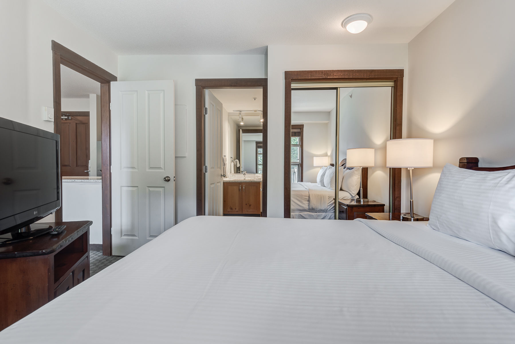 image Bright bedroom with a comfortable bed and plenty of space.