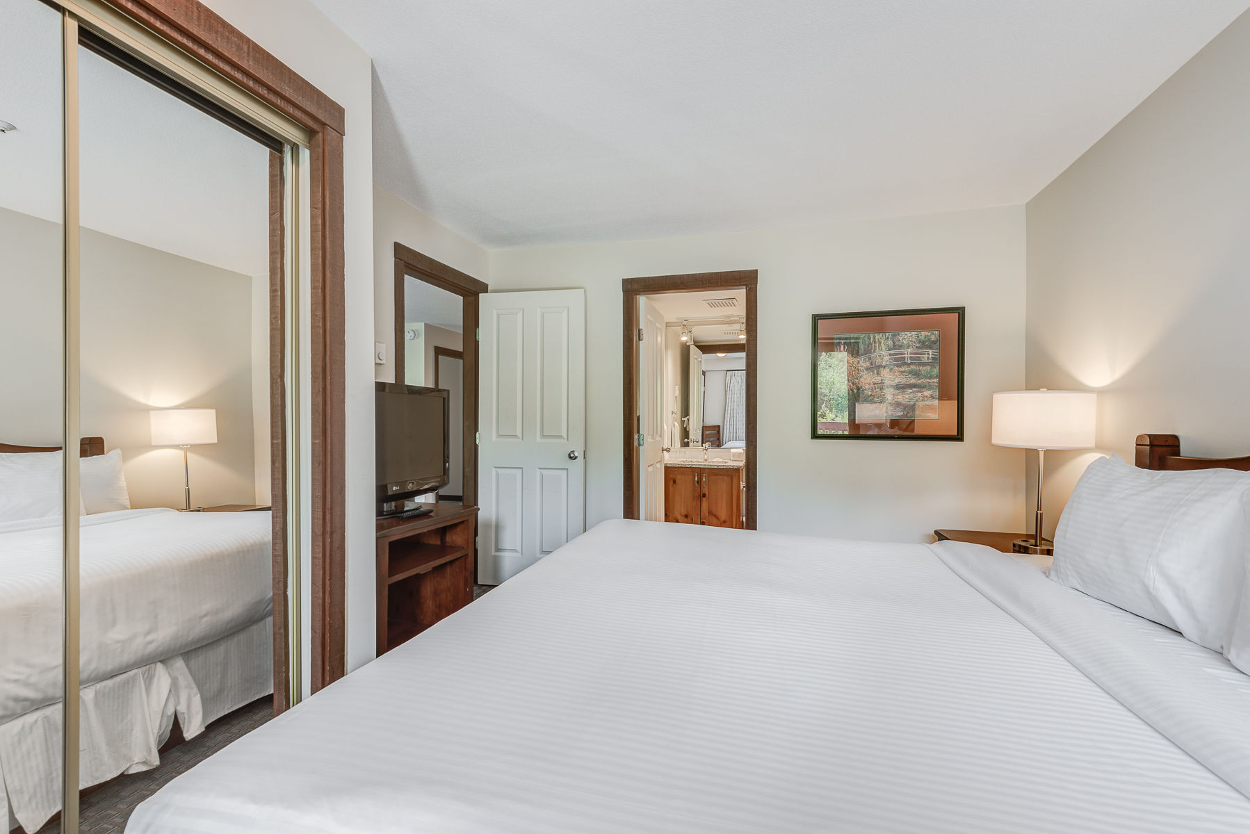 image Comfortable bedroom with a cozy large bed.