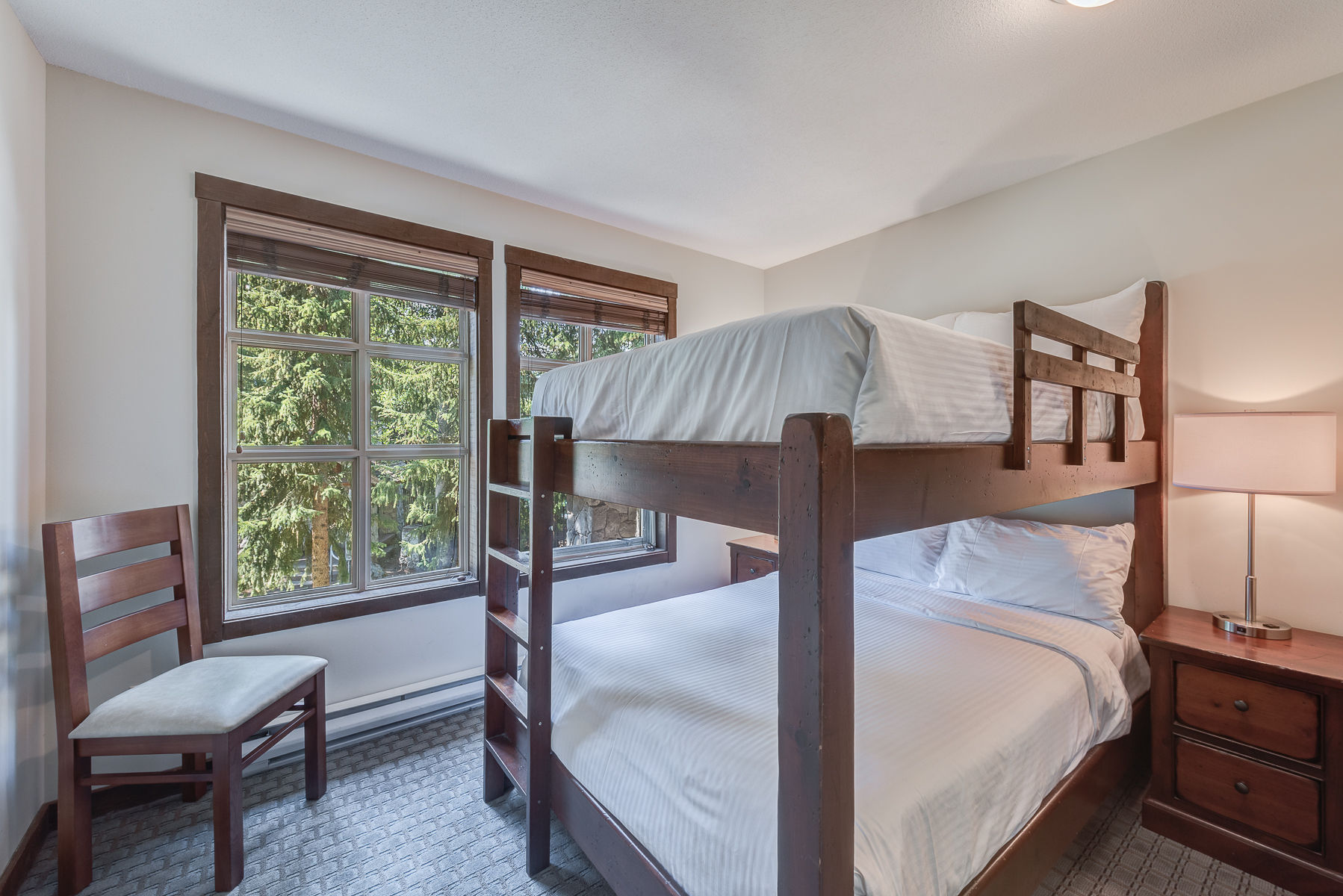 image Bright room with bunk beds, great for kids or extra guests.