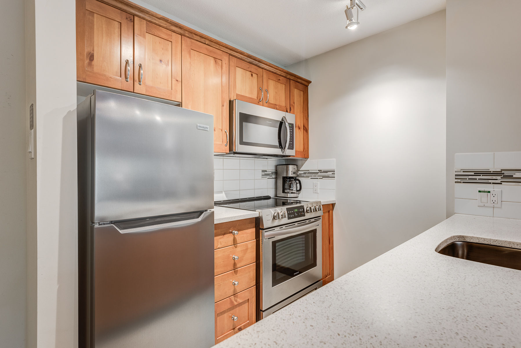 image Fully equipped kitchen with modern appliances and ample counter space.