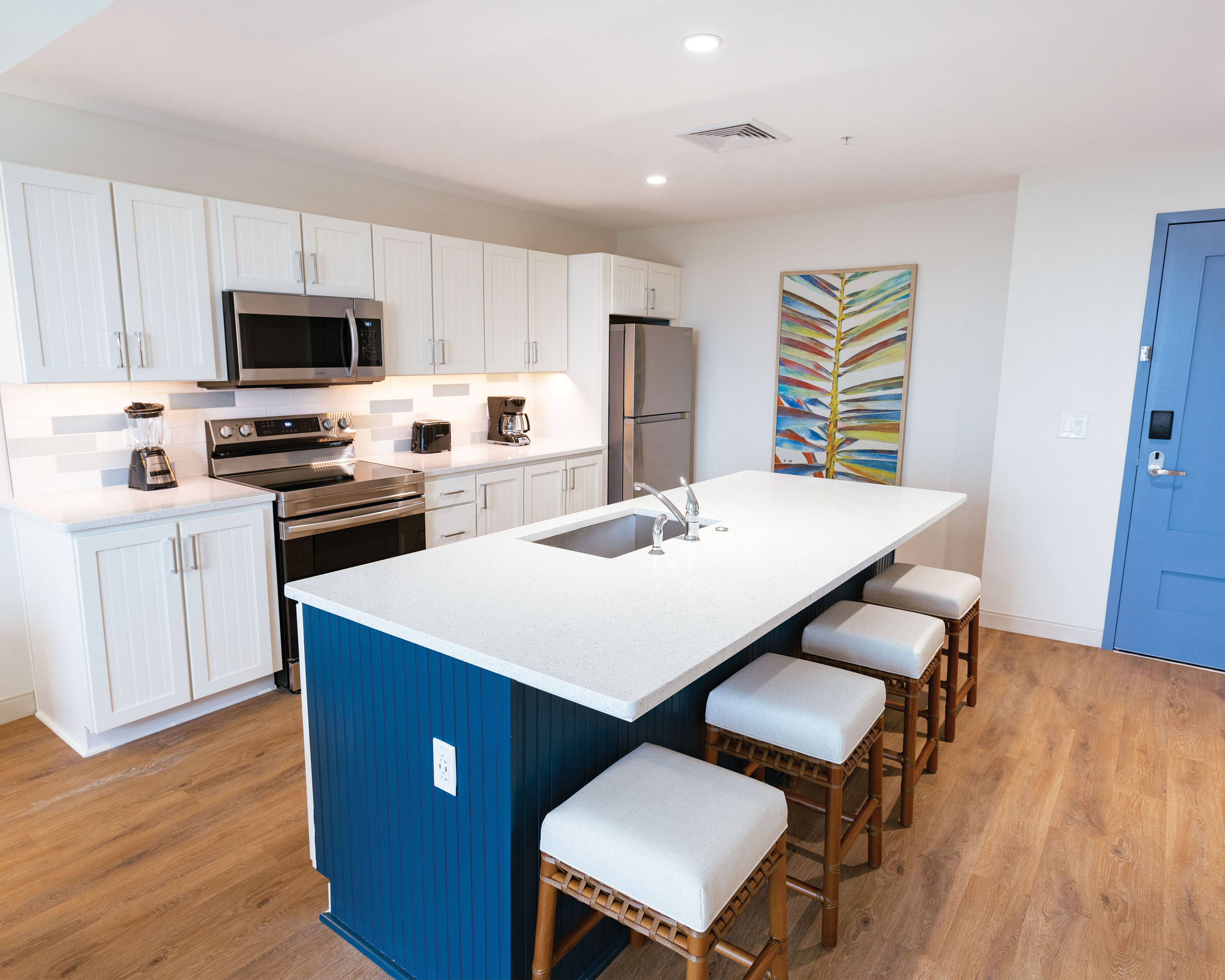 image Spacious kitchen with a large island and updated appliances, perfect for preparing meals during your stay.