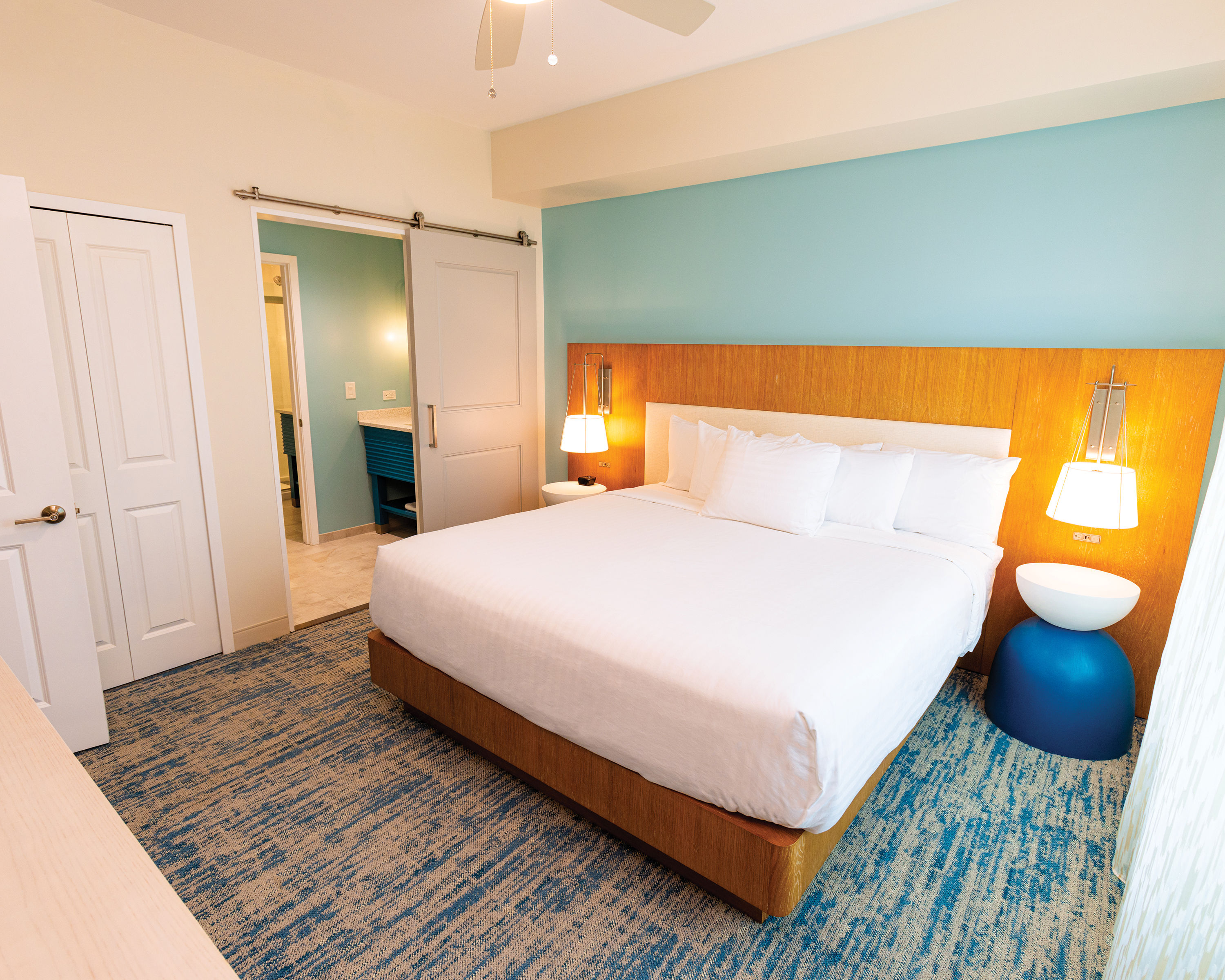 image A cozy, inviting bedroom with soft lighting and a plush bed, perfect for a restful night’s sleep.