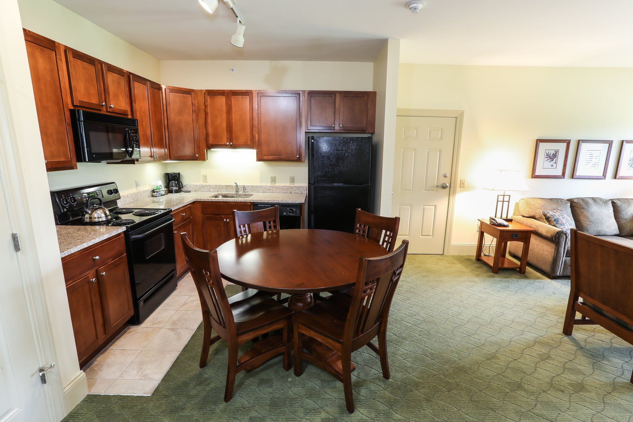 image Fully equipped kitchen with dining area, ideal for home-cooked meals.